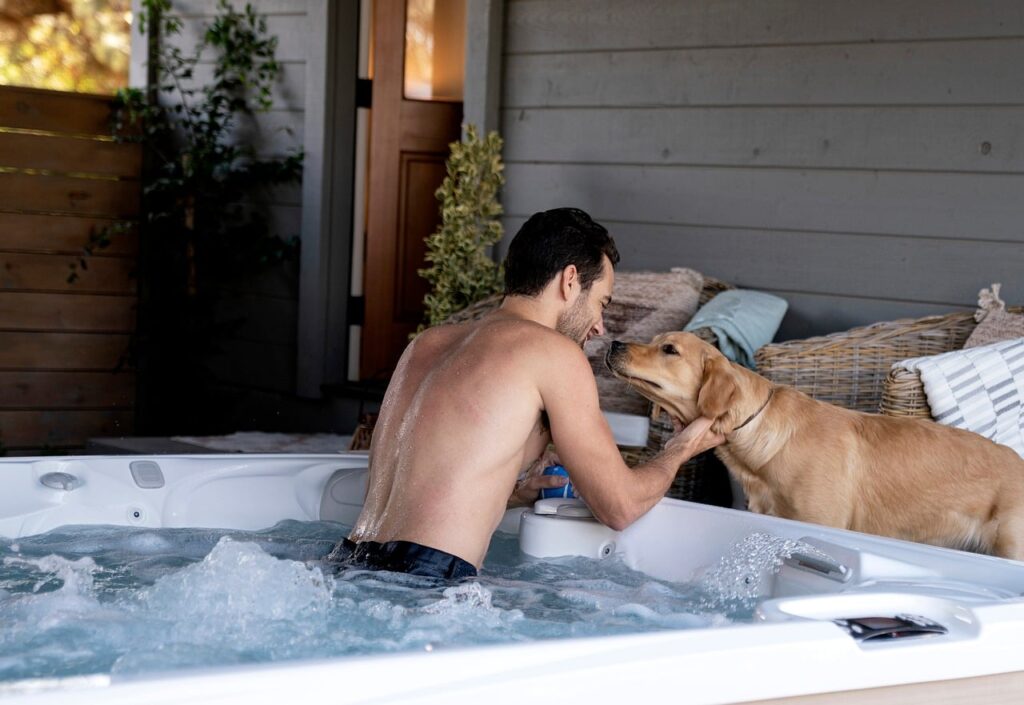 dog, hot tub, man, animal, water, blinds, room, puppy, relaxation, outdoor activities, pet, hugging, love, friendship, privacy, relaxation time, terrace, nature, laziness, cosiness