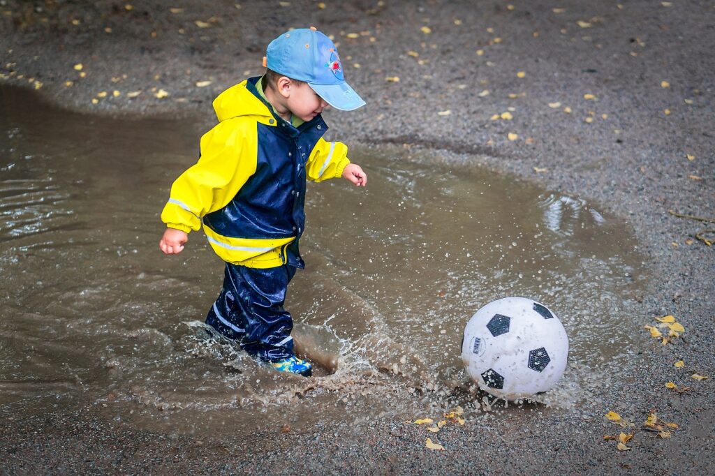 kid, child, young, childhood, happiness, outdoors, happy, playing, healthy, water, puddle, rings, hat, boy, son, happy kid, splash, football, ball, rolling, jumping, drops, liquid, wet, rain, rubber, rain clothes, gray happy, gray water, gray rain, gray healthy, gray football, gray clothes, nature, gray happiness
